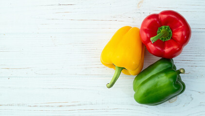 Wall Mural - Fresh sweet bell pepper ( paprika ) photography red , green and yellow . Colorful vegetable . Top view