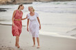 © Lumeez23/peopleimages.com - Walk, beach and senior mom with daughter for bonding holiday, love and chat on weekend travel. Nature, mother and woman laughing on ocean adventure together with conversation, fun and island vacation