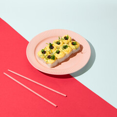 Sticker - Color Block Plate with Baked Cheese Topped Sushi Roll and Unagi Sauce