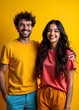 © Ahmed - Portrait of a beautiful couple hugging each other, Grabbing each other in arms, Smiling while side hugging each other. Isolated on yellow background.