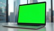 © Ali Hamza Tullah - Laptop Green Screen Mockup, placed on a table. Skyscraper background, Laptop Mockup, Green Screen Laptop