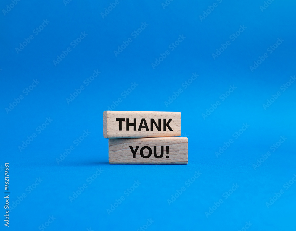 Thank you symbol. Wooden blocks with words Thank you. Beautiful blue ...