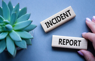 incident report symbol. concept word incident report on wooden blocks. beautiful grey background wit