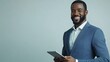 © PondLord - A confident insurance sales agent in a suit smiling while holding a tablet, standing against a light solid color background