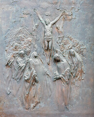 Wall Mural - MILAN, ITALY - MARCH 7, 2024: The modern brozne relief of Crucifixion on the gate of church Chiesa di Santa Maria del Suffragio by Ercole Franz De Vecchi (1996).