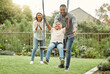 © KayJoint/peopleimages.com - Swing, parents and family with boy in park, happiness and bonding together with nature, smile and fun. Playground, mother and father with son, childhood and kid with break, excited and cheerful