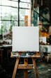 © Lubos Chlubny - Blank canvas standing on wooden easel in an art studio