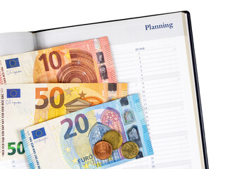 Euro banknotes and calendar.