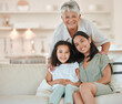 © peopleimages.com - Portrait of grandmother, mom and child on sofa for bonding, love or relax in living room. Family generation, happy home and grandma, mother and girl on couch with smile, hug or embrace in living room