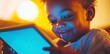 © DZMITRY - Grassy black child using smart tablet. African American boy gaming on iPad. Toddler using AI technology on tech device. Blue light from computer.
