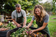 © Ирина Щукина - A man and a woman are smiling while they are working on a compost bin