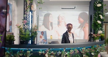 Wall Mural - Woman in thrift shop sorting out online orders from customers, dolly in shot. Retail clerk in second hand store looking at digital device screen, fulfilling shopping deliveries needing to be sent