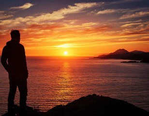 Wall Mural - A lone figure silhouetted against a vibrant sunset, contemplating the horizon.