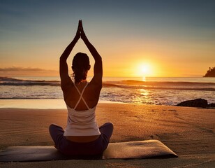 Wall Mural - A meditative scene of a yoga session at dawn, with a person in a seated pose on a beach