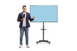 © Ljupco Smokovski - Full length portrait of male reporter with a microphone in front of a tv screen