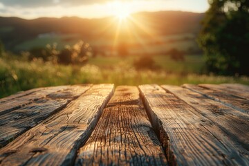 Poster - A wooden table with the sun setting in the background, perfect for capturing memories or creating a cozy atmosphere