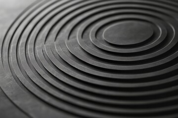 Poster - A closeup reveals a detailed geometric pattern featuring concentric circles in varied gray tones, showcasing a minimalist aesthetic