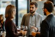 © Elmira - Professionals in semiformal attire engage in lively conversation while holding wine glasses at a networking event in an elegant venue