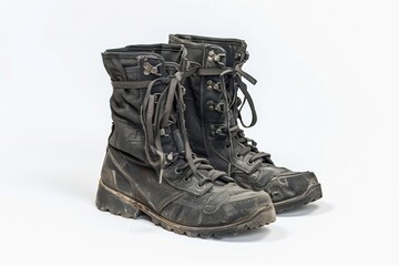 Poster - A close-up shot of a pair of black boots on a white background