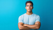 © Jhon - A hyper-realistic portrait of a young Venezuelan man with crossed arms on a blue background, exuding confidence and determination.