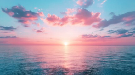 Wall Mural - Sunset over tranquil ocean with pink clouds