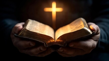 A person holding an open Bible with a glowing cross above it.