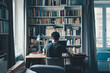 © Warunporn - Teenage boy studying online learning lesson on table in bedroom dormitory interior with large bookshelf.  Clean and cozy hostel share library room.