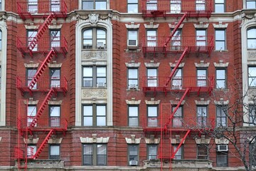 Wall Mural - New York, ornate old apartment building with external fire escape ladders painted red