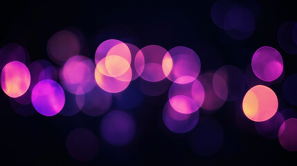 a blurred photo shows round bokeh lights in olive and lavender colors on a black background