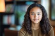 © LimeSky - Teenage mixed race girl high school student participating in online class from home Portrait during virtual education video call