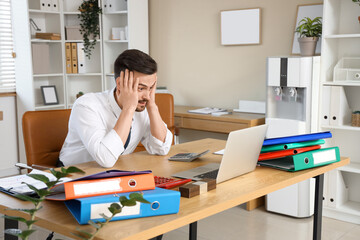 Sticker - Stressed male accountant working at table in office