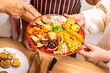 © CandyRetriever  - Group of Happy Asian senior women having dinner together at home. Elderly retired woman friends enjoy healthy lifestyle cooking and making vegan food vegetables salad with tofu together in the kitchen