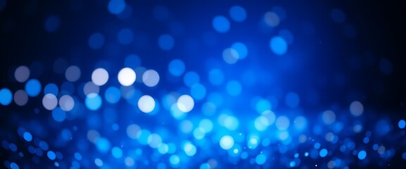 Abstract blue bokeh background with blurred lights.