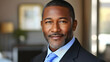 © Siasart Stock - Close-up portrait of a confident African American businessman wearing a suit.