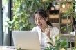 © LimeSky - Thrilled Asian woman celebrates online victory on laptop happy student excited about internet success