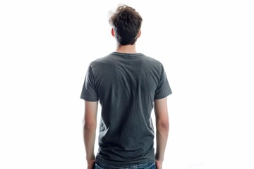 young man in jeans and t shirt looks away from camera view from behind collection of people white ba