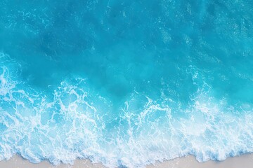 Soft foam forming over turquoise ocean water as gentle waves ripple across the peaceful and calm sea surface.
