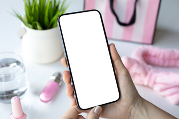 female hands hold phone with isolated screen background pink objects