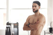 © peopleimages.com - Arms crossed, exercise and portrait of shirtless man in boxing gym for challenge, self defense or sports training. Body, fitness and wellness with confident athlete in health club for workout