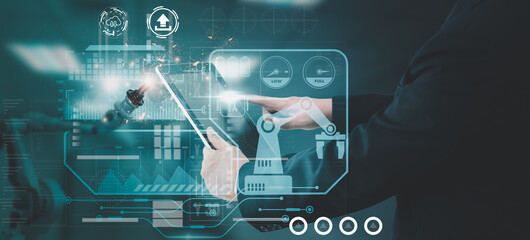 Wall Mural - industry engineer in factory,using smart tablet device,control automated robot arm machine learning 