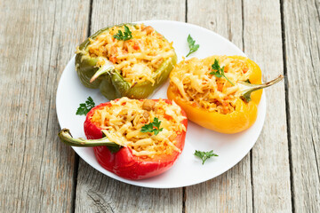 Canvas Print - Baked stuffed pepper ( paprika ) with rice , carrot and meat . Top view on rustic background