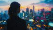 © Teeraphon - Abstract business man stands on the peak of success amid tall, innovative Smart city and graphs with statistics to analyze business potential and predict future developments in company growth.