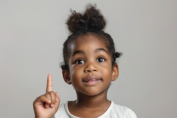 Poster - A young girl with her finger raised, ready to make a point