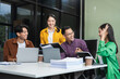 © NINENII - Group of Young Asian business team creative businesspeople coworker in office Happy to be successful partnership teamwork success concept.