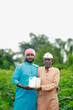 © SDV Ads - happy two Indian farmer standing in farm