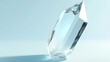 © Galib - A clear crystal on a light blue surface.