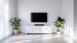 © pvl0707 - Sleek black soundbar elegantly mounted above a chic white cabinet in a modern minimalist home entertainment setup