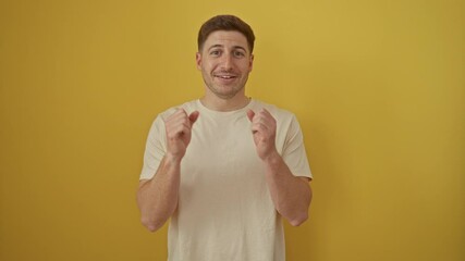 Sticker - Young hispanic man standing over isolated yellow background celebrating achievement with happy smile and winner expression