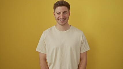 Sticker - Young hispanic man standing with a confident smile showing teeth, looking happy and positive over isolated yellow background