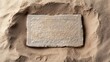 © naphat - An ancient stone tablet with Hebrew inscriptions, partially buried in sand, representing the historical roots of Judaism, copy space for text,